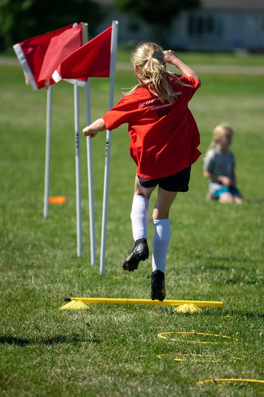 Kid playing soccer.